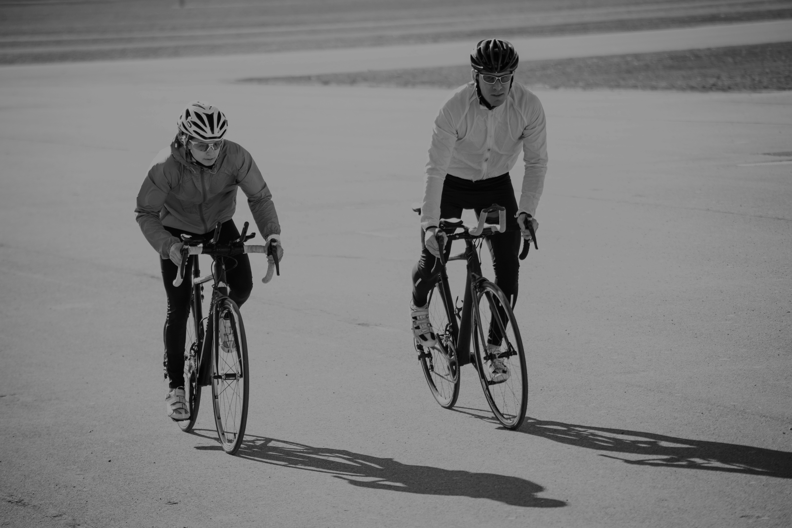 two-cyclists-riding-on-a-paved-road-in-daytime-2024-07-06-01-39-31-utc